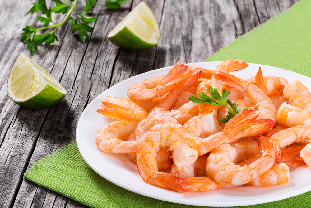 A plate of cooked shrimps.