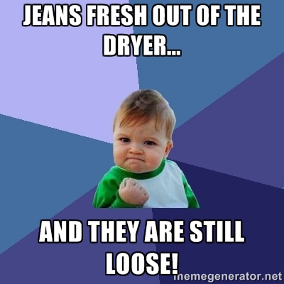 Baby with fist raised in victory says "jeans fresh out of the dryer... and they are still loose!"
