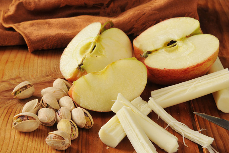 Choose snacks like apples, cheeses, and nuts during the day to lose weight without starving yourself.