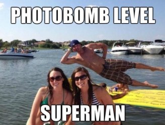 Girls in bikinis on the lake photobombed by a cute guy: Photobomb level superman!