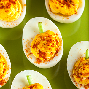 Pumpkin deviled eggs from Personal Trainer Food are a low-carb fall snack, perfect to help you lose 10-20 pounds before the New Year hits.