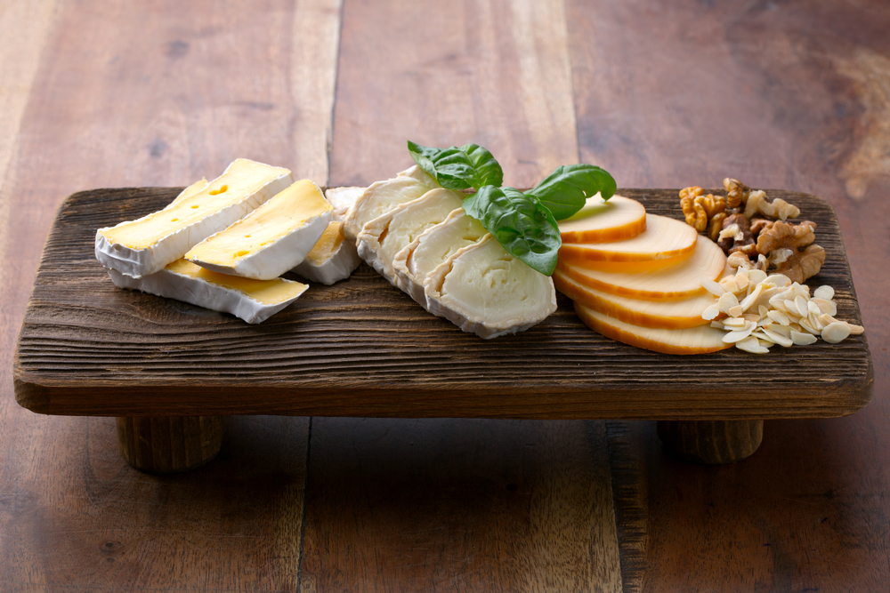 A cheese flight is perfect while dining out with Personal Trainer Food.