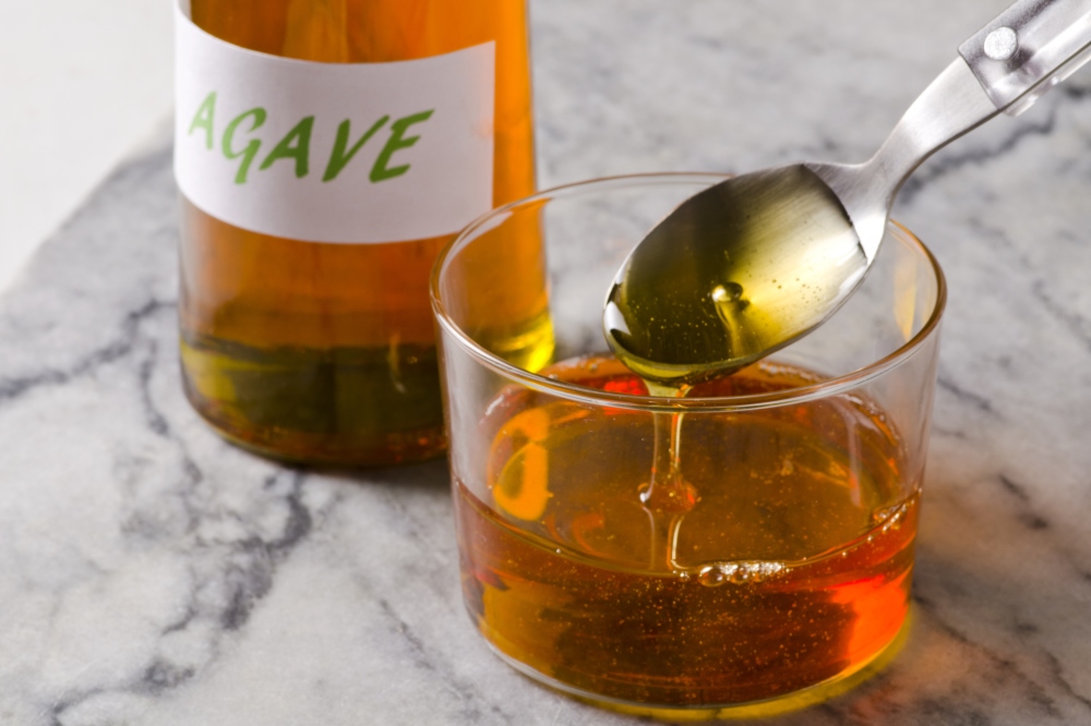 Agave syrup poured in a bowl ready poison your liver.
