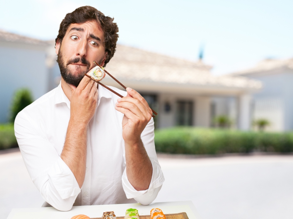 A man looks fearfully at his high glycemic index sushi an example of which health foods make fat.
