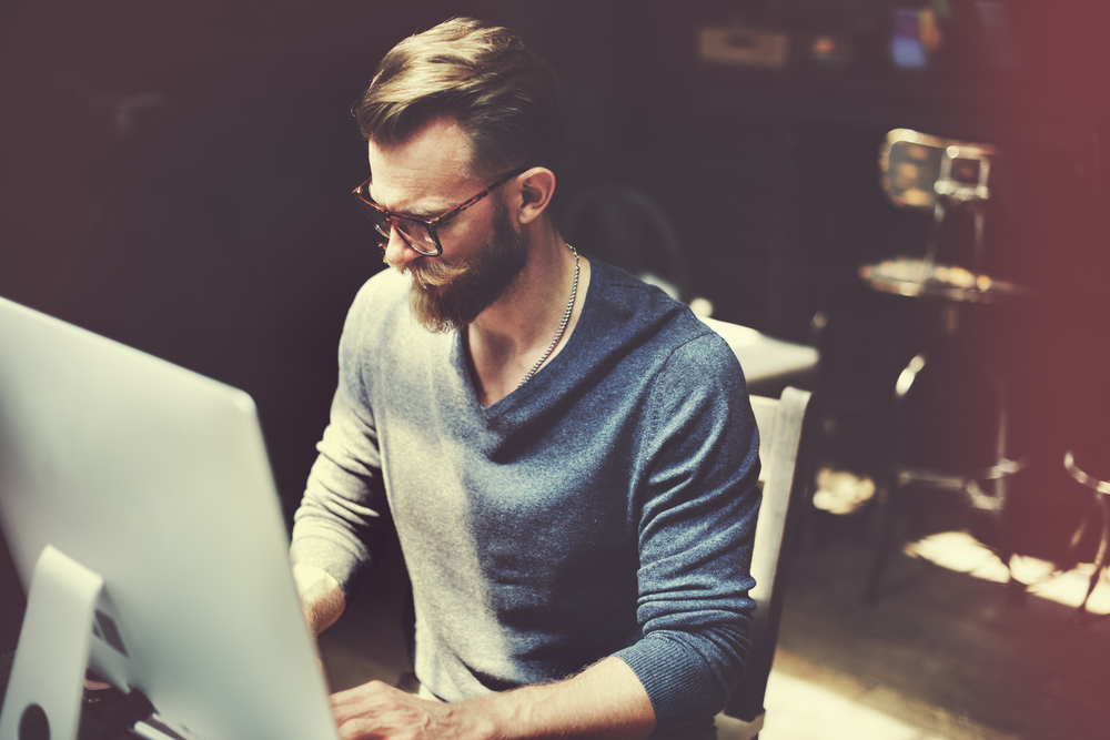 A man works at his desk.